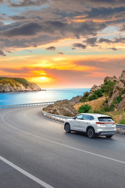 white car driving on beach 600nw 2444271335